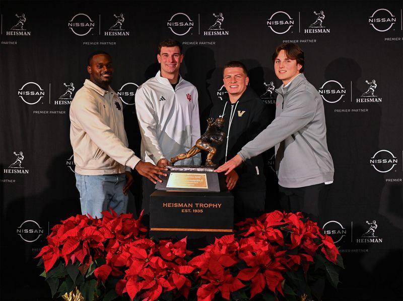 Indiana football quarterback Fernando Mendoza poses with the other Heisman Trophy finalists in New York on Friday afternoon.