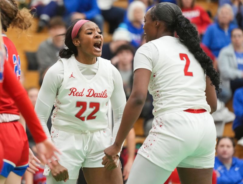 Pike Red Devils forward Marley Jeffers (22) yells in excitement Monday, Dec. 15, 2025, during the game at Lawrence North High School in Indianapolis. The Pike Red Devils defeated the Roncalli Royals.