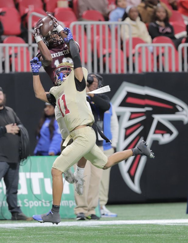Benedictine's Eron Mallard hauls in a catch over Creekside's Sean Williams during the GHSA State 4-A Championship game on Monday, December 15, 2025 at the Mercedes-Benz Stadium in Atlanta, Ga..