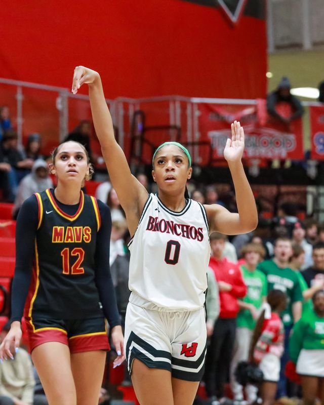 Jeff guard Da'Niyah Johnson (0) watches her shot go up in Jeff's game against McCutcheon on Dec. 16, 2025.