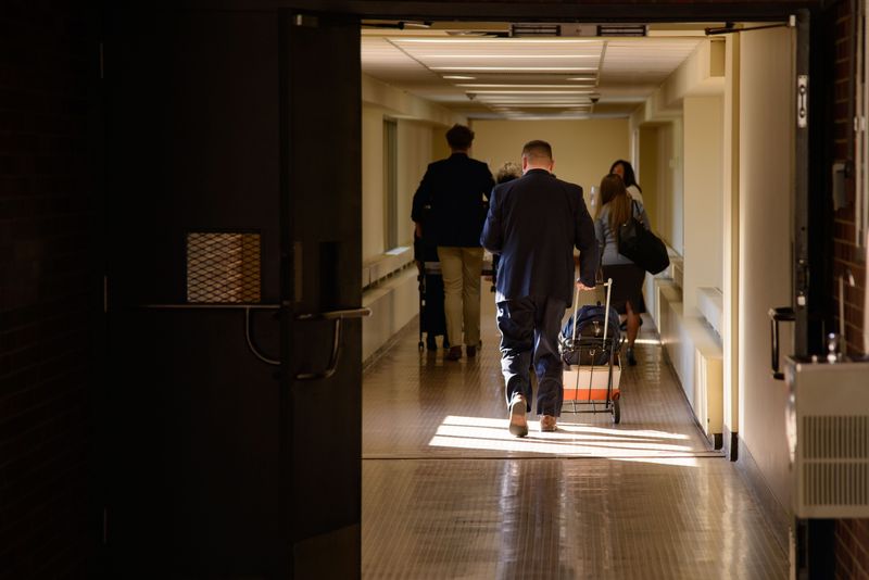 Prosecutors Diana Moers and Stan Levco leave Vanderburgh County Circuit Court alongside Evansville Police Department Detective Aaron McCormick and staffers on Wednesday, Dec. 17, 2025.
