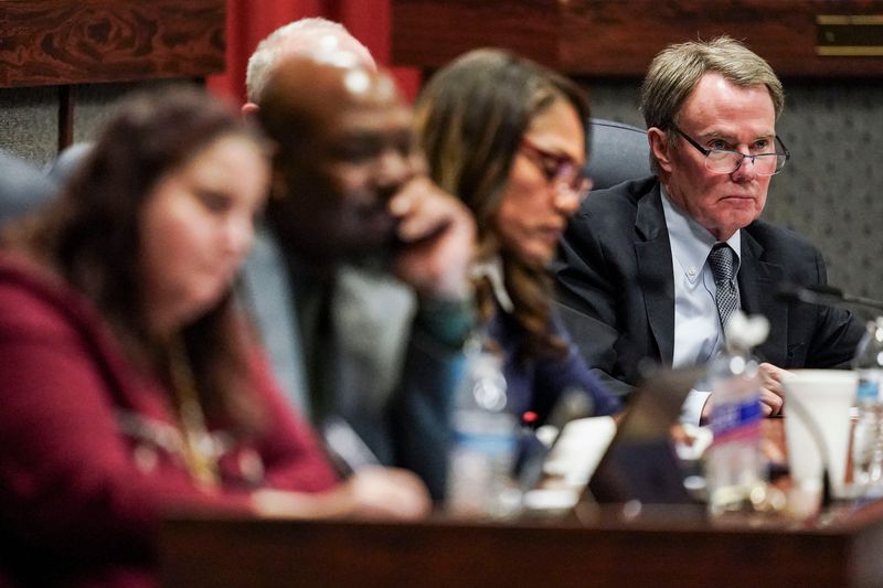 Mayor Joe Hogsett (right) listens to the community Wednesday, Dec. 17, 2025, during a meeting as ILEA takes its final vote on recommendations for the future of IPS at the City-County Building in Indianapolis.
