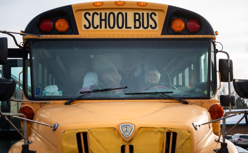 Students load into the bus of driver Joy Merriman on Wednesday, Dec. 17, 2025, at Waverly Elementary School in Martinsville, Indiana. The school is part of the Mooresville School system.