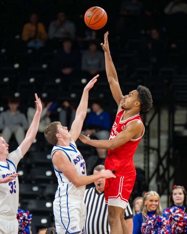 Fishers High School senior Kai McGrew (25) shoots during the first half of a Mudsock Rivalry basketball game against Fishers High School, Friday, Dec. 19, 2025, at Fishers Event Center.