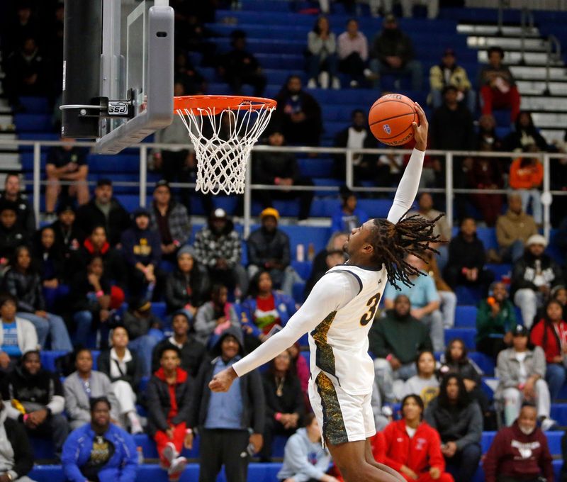 Riley senior Tyrese Jones attempts to dunk the ball during a boys basketball game against Niles in the Michiana Hoops Shootout Saturday, Dec. 20, 2025, at Marian High School in Mishawaka.