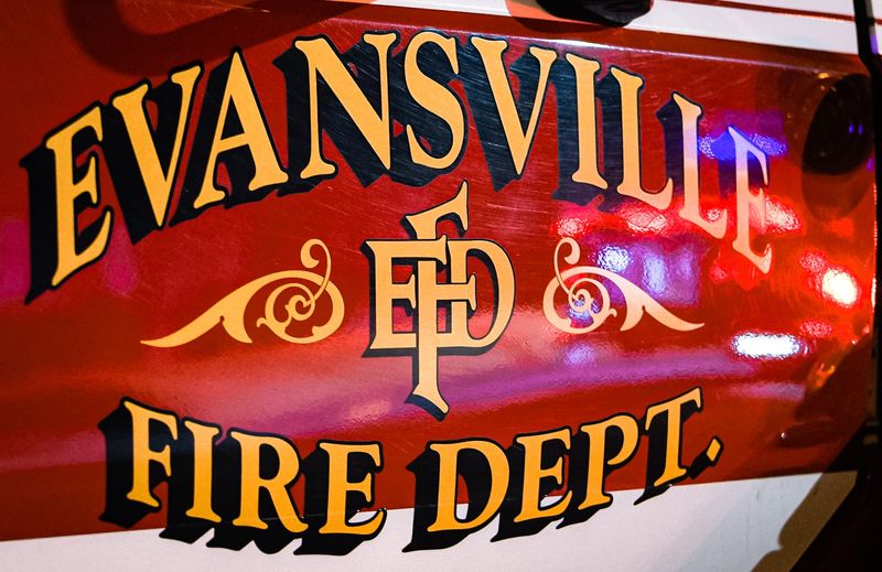 Emergency lights reflect off an Evansville Fire Department truck on June 24, 2023.