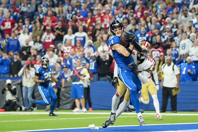 Dec 22, 2025; Indianapolis, Indiana, USA; Indianapolis Colts wide receiver Alec Pierce (14) makes a catch for a touchdown in front of San Francisco 49ers cornerback Darrell Luter Jr. (28) during the second quarter at Lucas Oil Stadium. Mandatory Credit: Grace Hollars-USA TODAY Network via Imagn Images