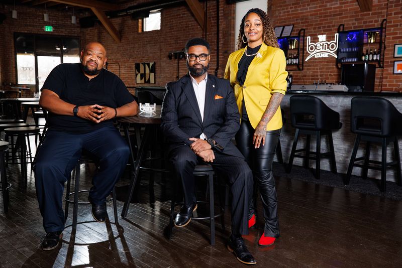 The Bend Lounge partners from left to right: Mychael Winston, ArmarÕrae Hill and Aja Ellington pose for a photo at the bar on Tuesday, Feb. 11, 2025, in South Bend.