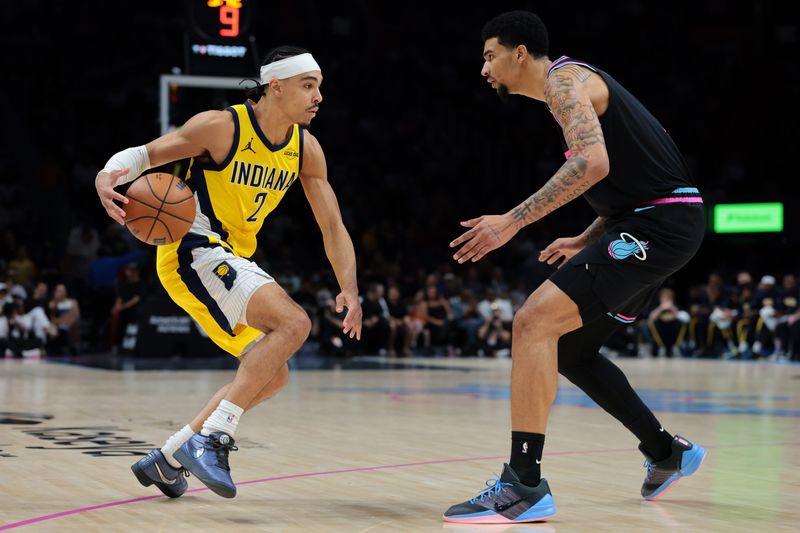 Dec 27, 2025; Miami, Florida, USA; Indiana Pacers guard Andrew Nembhard (2) drives to the basket against Miami Heat center Kel'El Ware (7) during the first half at Kaseya Center. Mandatory Credit: Sam Navarro-Imagn Images