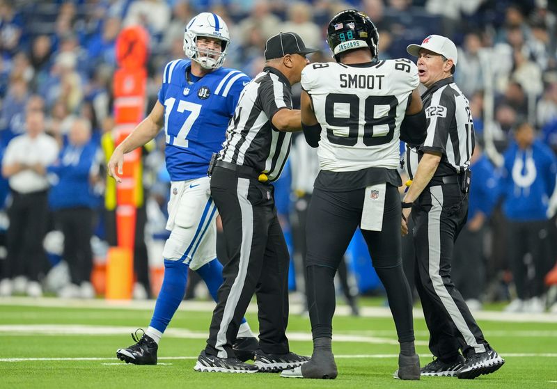 Indianapolis Colts quarterback Philip Rivers (17) and Jacksonville Jaguars defensive end Dawuane Smoot (98) exchange words Sunday, Dec. 28, 2025, during a game at Lucas Oil Stadium in Indianapolis.