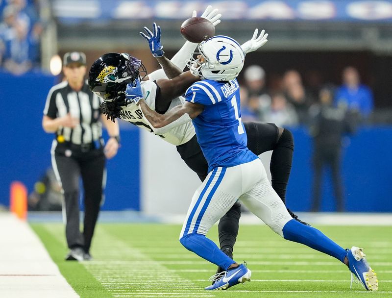Indianapolis Colts cornerback Sauce Gardner (1) breaks up a pass intended for Jacksonville Jaguars wide receiver Brian Thomas Jr. (7) on Sunday, Dec. 28, 2025, during a game at Lucas Oil Stadium in Indianapolis.
