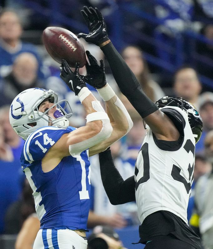 Jacksonville Jaguars cornerback Montaric Brown (30) breaks up a pass intended for Indianapolis Colts wide receiver Alec Pierce (14) on Sunday, Dec. 28, 2025, during a game at Lucas Oil Stadium in Indianapolis.