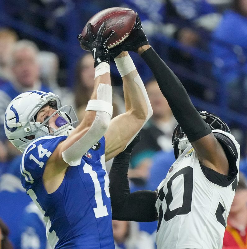 Jacksonville Jaguars cornerback Montaric Brown (30) breaks up a pass intended for Indianapolis Colts wide receiver Alec Pierce (14) on Sunday, Dec. 28, 2025, during a game at Lucas Oil Stadium in Indianapolis.