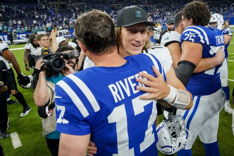 Jacksonville Jaguars quarterback Trevor Lawrence (16) and Indianapolis Colts quarterback Philip Rivers (17) meet on the field Sunday, Dec. 28, 2025, after the Jacksonville Jaguars defeated the Indianapolis Colts 23-17 at Lucas Oil Stadium in Indianapolis.
