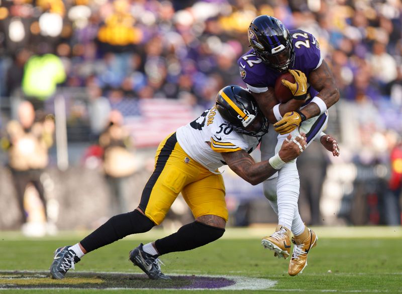 Dec 7, 2025; Baltimore, Maryland, USA; Pittsburgh Steelers linebacker Malik Harrison (50) tackles Baltimore Ravens running back Derrick Henry (22) during the first half at M&T Bank Stadium. Mandatory Credit: Peter Casey-Imagn Images