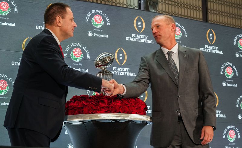 Indiana Hoosiers head coach Curt Cignetti and Alabama Crimson Tide head coach Kalen Deboer shake hands Wednesday, Dec. 31, 2025, during a coaches press conference ahead of the Rose Bowl at the Sheraton Grand Los Angeles.