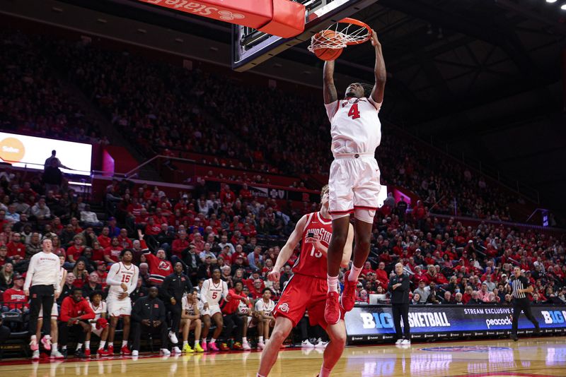 Jan 2, 2026; Piscataway, New Jersey, USA; Rutgers Scarlet Knights forward Bryce Dortch (4) dunks the ball during the second half in front of Ohio State Buckeyes center Christoph Tilly (13) at Jersey Mike's Arena. Mandatory Credit: Vincent Carchietta-Imagn Images