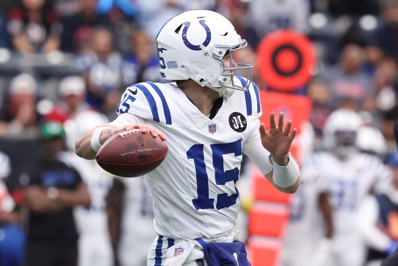 Jan 4, 2026; Houston, Texas, USA; Indianapolis Colts quarterback Riley Leonard (15) throws downfield against the Houston Texans during the first half at NRG Stadium. Mandatory Credit: Troy Taormina-Imagn Images