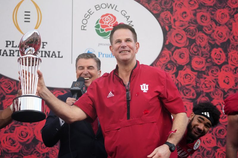 Jan 1, 2026; Pasadena, CA, USA; Indiana Hoosiers head coach Curt Cignetti holds the Leishman Trophy after victory over the Alabama Crimson Tide at the 2026 Rose Bowl and quarterfinal game of the College Football Playoff at Rose Bowl Stadium. Mandatory Credit: Kirby Lee-Imagn Images