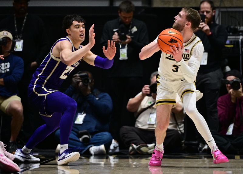 Jan 7, 2026; West Lafayette, Indiana, USA; Purdue Boilermakers guard Braden Smith (3) looks at the basket over Washington Huskies guard J.J. Mandaquit (23) during the first half at Mackey Arena.
