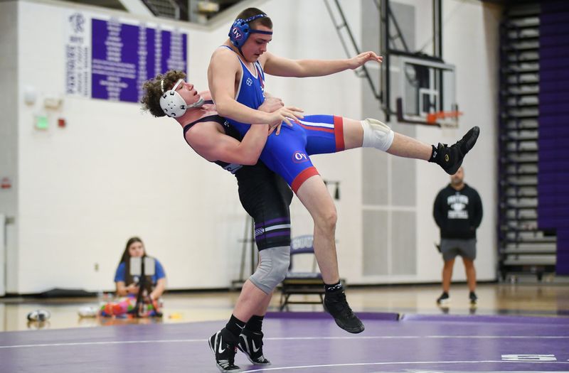 Bloomington South's Denny Allgood wrestles against Owen Valley's Luke Burner in the 175-pound match during the Bloomington South-Owen Valley wrestling match at South on Wednesday, Jan. 7, 2026.