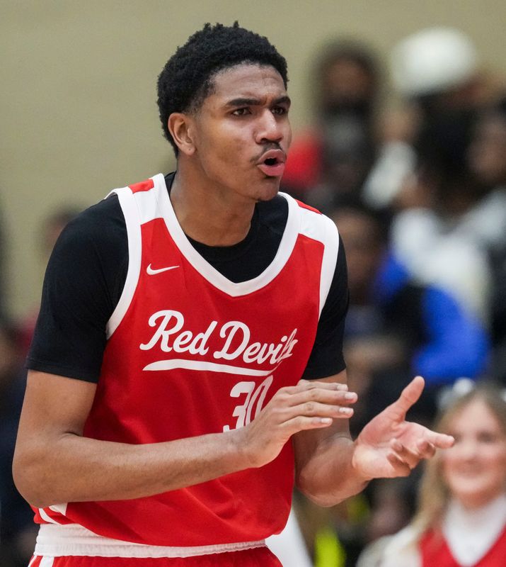 Pike Red Devils Isaiah Hill (30) celebrates Thursday, Jan. 8, 2026, during a game between the Fishers Tigers and the Pike Red Devils at Fishers High School. The Fishers Tigers defeated the Pike Red Devils, 76-67.
