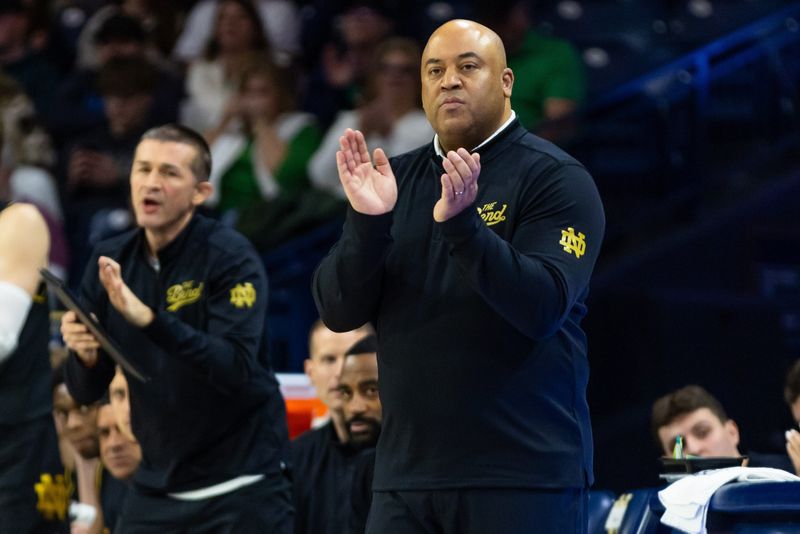 Jan 10, 2026; South Bend, Indiana, USA; Notre Dame Fighting Irish head coach Micah Shrewsberry claps on the sideline against the Clemson Tigers during the first half at Purcell Pavilion at the Joyce Center. Mandatory Credit: Michael Caterina-Imagn Images