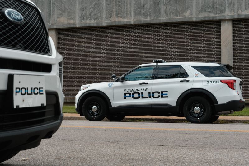 Evansville Police Department cruisers are seen parked on Sycamore Street across from headquarters on Aug. 8, 2023.