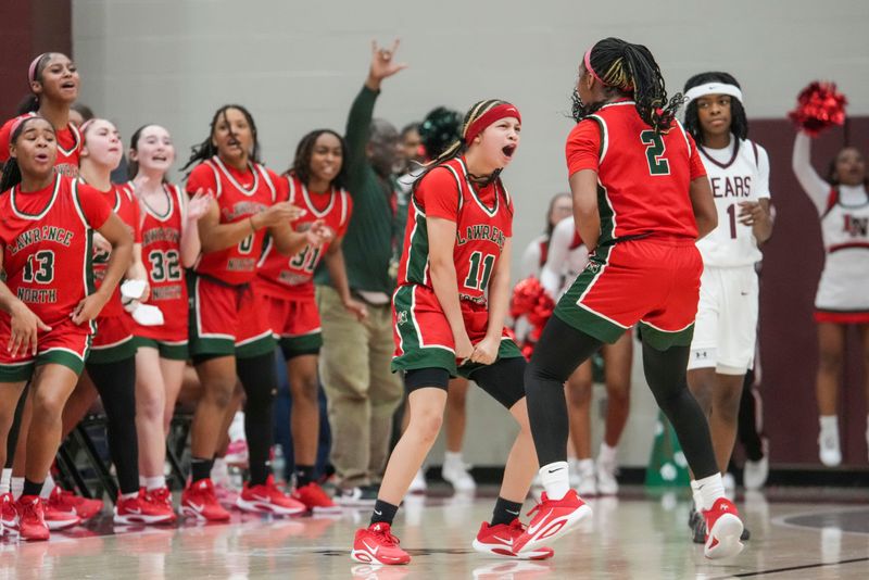 Lawrence North Wildcats guard Jayla Miller (11) and Lawrence North Wildcats guard Brooklyn Robers (2) celebrate Thursday, Jan. 15, 2026, during a game between the Lawrence Central Bears and the Lawrence North Wildcats at Lawrence Central High School in Indianapolis. The Bears defeated the Wildcats, 58-51.