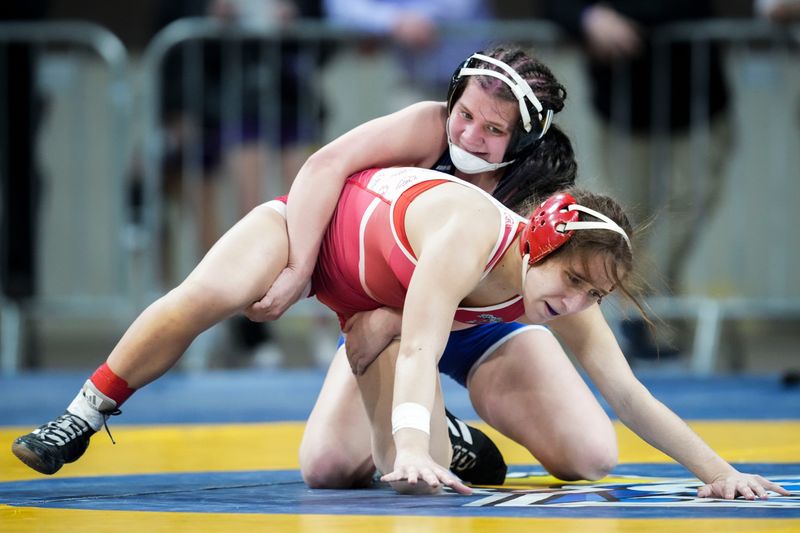 Whiteland Communty’s Kahlyn Fouty and Crown Point’s Helene Papadakis compete Friday, Jan. 16, 2026, in a 125-pound bout semifinals match at the 2026 IHSAA girls wrestling state finals at Corteva Coliseum at the Indiana State Fairgrounds in Indianapolis.