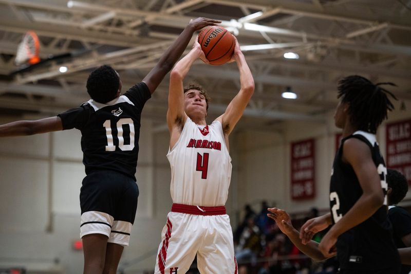 Arsenal Technical's Careyon Fryerson (10) attempts to block Harrison's Dean Underwood (4) as the Harrison Warriors play the Arsenal Technical Titans during the sixth annual Banterra Bank Warrior Showcase at Harrison High School in Evansville, Ind., Friday, Jan. 16, 2026.