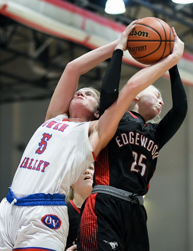 Owen Valley’s Mallory Owen (5) and Edgewood’s Ava Laroche (25) go for a rebound during the girls’ basketball game at Owen Valley on Friday, Jan. 16, 2026.