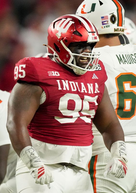 Indiana Hoosiers defensive lineman Tyrique Tucker (95) reacts to a stop Monday, Jan. 19, 2026, during the College Football Playoff National Championship college football game against the Miami (FL) Hurricanes at Hard Rock Stadium in Miami Gardens.