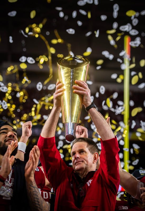 Indiana Head Coach Curt Cignett hoists the trophy after the College Football Playoff National Championship college football game at Hard Rock Stadium in Miami Gardens on Monday, Jan. 19, 2026.
