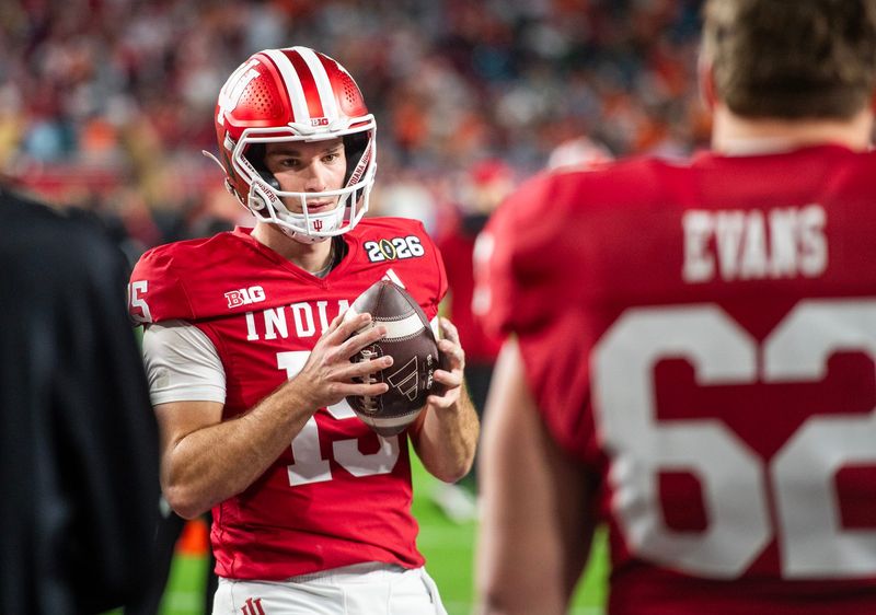 Indiana's Fernando Mendoza (15) gets loose before the College Football Playoff National Championship college football game at Hard Rock Stadium in Miami Gardens on Monday, Jan. 19, 2026.
