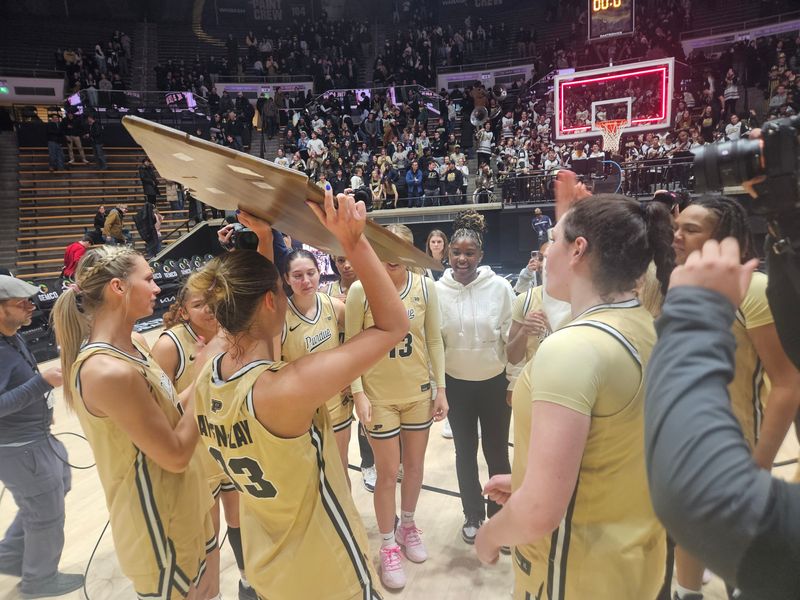 Purdue captain Madison Layden-Zay (center) hoists the Barn Burner Trophy after beating Indiana 80-69 on Sunday, Jan. 25, 2026 in West Lafayette, Indiana.