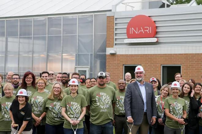 Former Gov. Eric Holcomb poses for photos with employees of Inari at a ground breaking event, Wednesday, June 2, 2021 in West Lafayette. Inari, headquartered in Cambridge, Mass., is a gene editing company enhancing the yield of soy bean and corn seeds.
