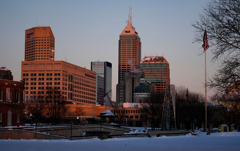 The sunsets Monday, Jan. 26, 2026, as a winter storm brought heavy snow and single digit temperatures in downtown Indianapolis.