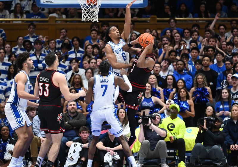 Jan 26, 2026; Durham, North Carolina, USA; Louisville Cardinals guard Ryan Conwell (3) attempts to shoot over Duke Blue Devils forward Maliq Brown (6) during the second half at Cameron Indoor Stadium. Mandatory Credit: Rob Kinnan-Imagn Images