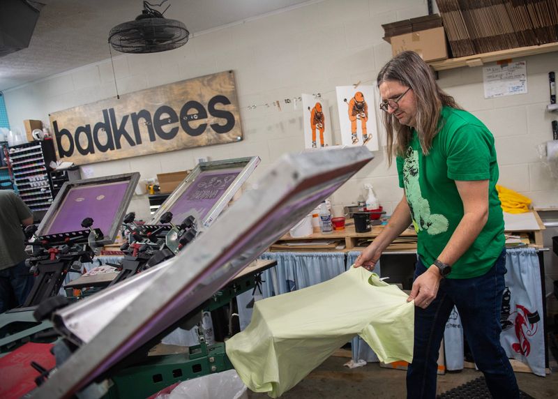 Owner Jim Beck prints a shirt with the "ICE Out" logo at BadkneesT's store on Kirkwood Avenue on Friday, Jan. 30, 2026.
