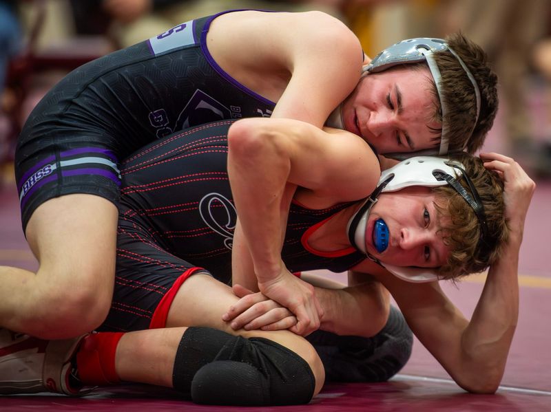 South's Nick Russell wrestles Terre Haute South's Lucas Overton in the 106 lbs. match during the IHSAA sectional wrestling meet at Bloomington High School North on Saturday, Jan. 31, 2026.