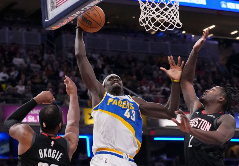 Indiana Pacers forward Pascal Siakam (43) dunks the ball while being defended by Houston Rockets guard Josh Okogie (20) and Houston Rockets forward Dorian Finney-Smith (2) during a game Monday, Feb. 2, 2026, at Gainbridge Fieldhouse in Indianapolis. The Pacers fell to the Rockets 118-114.
