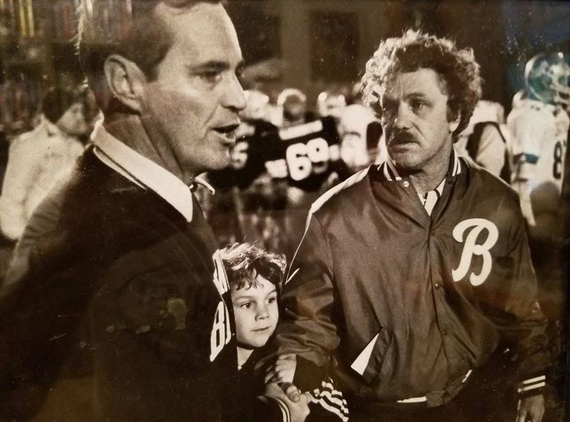 Dave Enright (right) coaching at Bloomington South against Dick Renard of Bloomington North. A young Kyle Enright is in the middle.