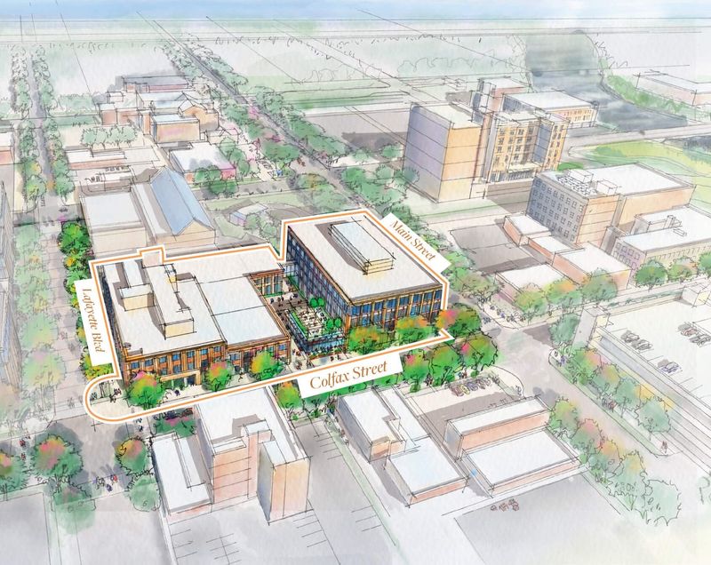 This provided rendering shows an aerial view of the Colfax Corner project, which aims to incorporate the historic South Bend Tribune building and a new five-story building separated by a public courtyard.