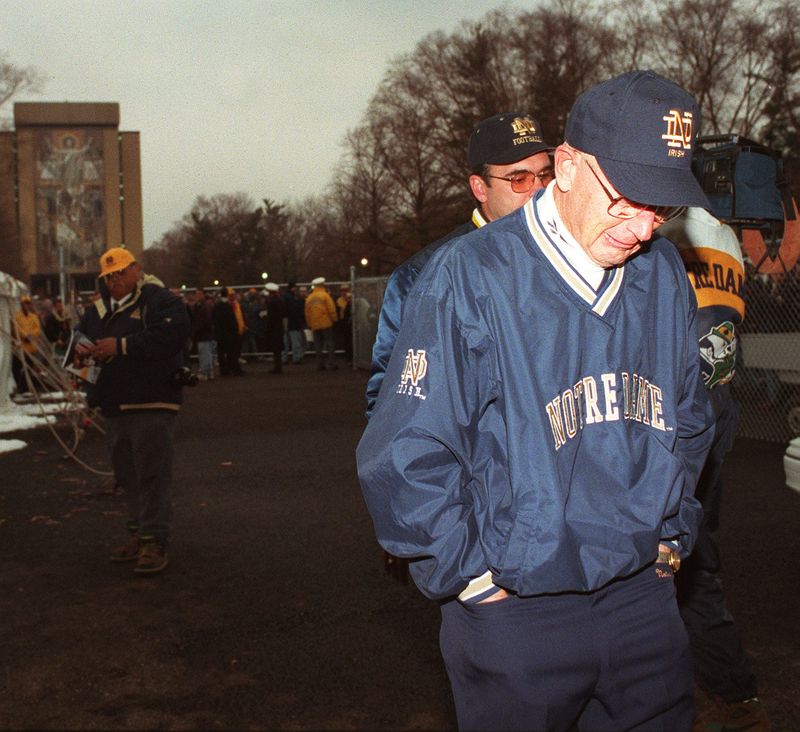 A tearful Lou Holtz leaves the press conference following ;his last home game as head football coach at Notre Dame. ISR file/Rutger/Nd/ballotts folder 11/23/96 mac 1