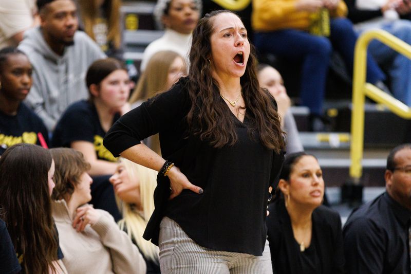 Penn's head coach Kristi Ulrich yells out to her players during an IHSAA girl's basketball sectional championship game between Penn and Adams at Penn High School on Saturday, Feb. 7, 2026, in Mishawaka.