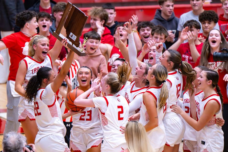 Center Grove High School players celebrate after winning an IHSAA class 4A sectional championship game against Franklin Central High School, Saturday, Feb. 7, 2026, at Center Grove High School. Center Grove High School won 55-50.