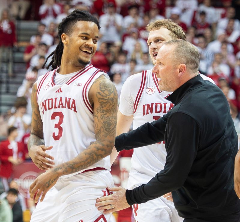 Indiana's Lamar Wilkerson (3) smiles as Head Coach Darian DeVries helps him get up from the floor during the Indiana versus Oregon men's basketball game at Simon Skjodt Assembly Hall on Monday, Feb. 9, 2026.