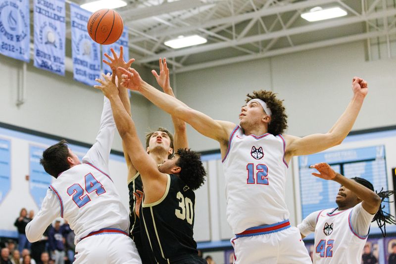 Penn and Saint Joseph go after a loose ball during an IHSAA boys basketball game between Saint Joseph and Penn at Saint Joseph High School on Tuesday, Feb. 10, 2026, in South Bend.