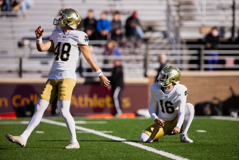 Nov 1, 2025; Chestnut Hill, Massachusetts, USA; Notre Dame kicker Marcello Diomede (48) and punter James Rendell (16) warm up on the field before the game against the Boston College Eagles at Alumni Stadium. Mandatory Credit: Edward Finan-Imagn Images